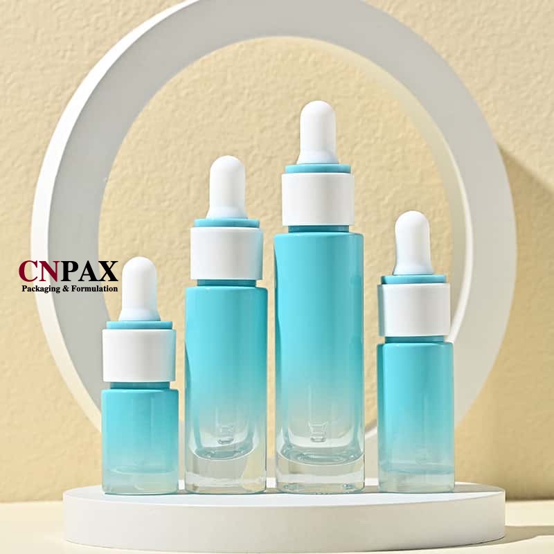 gradient blue glass serum bottles